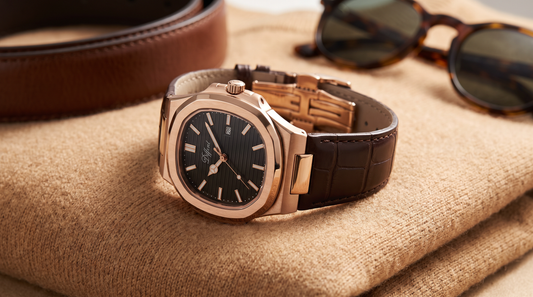 DIFFRNT Atlas rose gold watch on a camel sweater with a leather belt and sunglasses